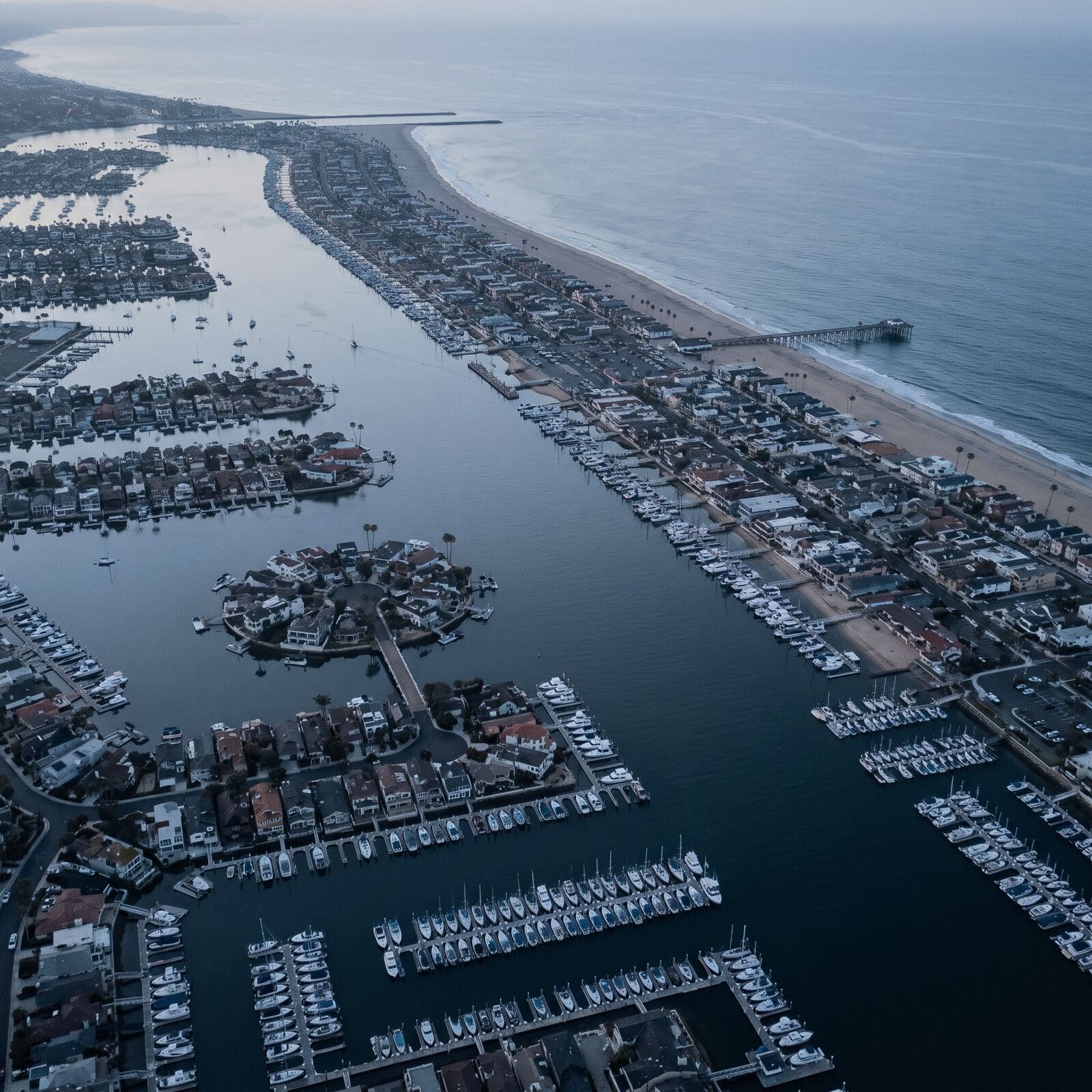Newport Beach from the air at dawn: the harbor, the Balboa Peninsula and the pier